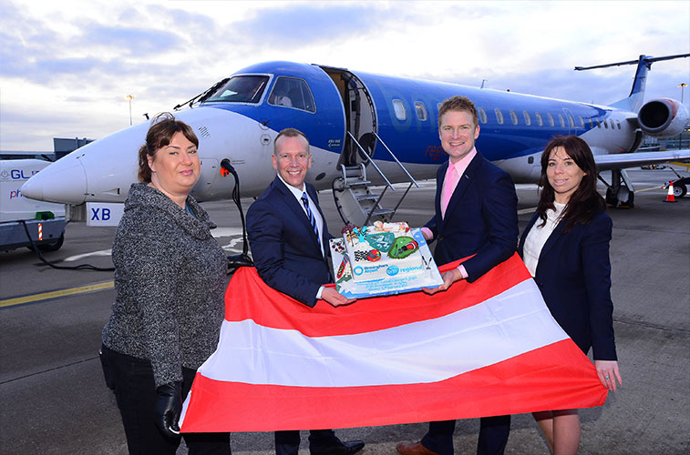 Holding the Austrian flag and superb route launch cake were: Amanda Taylor, Travel Manager at Jaguar Land Rover; Frank Mertens, Head of Marketing at bmi regional; Tom Screen, Head of Aviation Development at Birmingham Airport; and Stephanie Bowes, Travel Trade and Corporate Relationship Manager at Birmingham Airport.